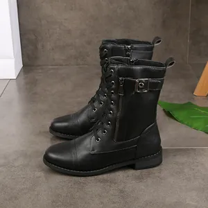 Side view of black lace-up combat boots featuring a metal buckle and side zipper.
