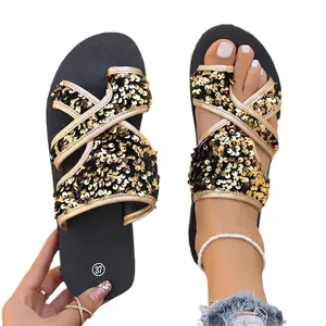 Claquettes de plage noires pour femmes avec lanières croisées à paillettes dorées