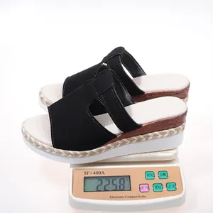 Detailed view of lightweight women's black wedge platform sandals weighing 225.8 grams