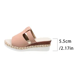 Side view detail of a stylish pink wedge sandal showing the 5.5cm heel height measurement.