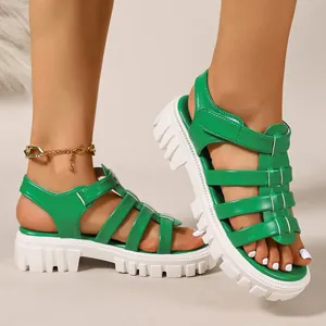 Trendy green gladiator platform sandals featuring chunky white lug soles and straps