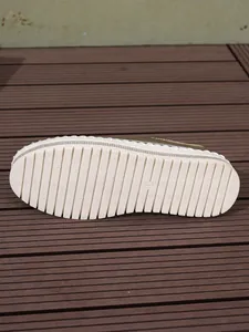 Macro view of the textured non-slip rubber outsole for women's platform loafers