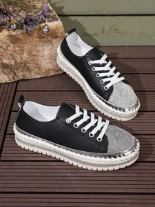 Fashion women's platform sneakers with sparkling rhinestone toes and woven sole detail.
