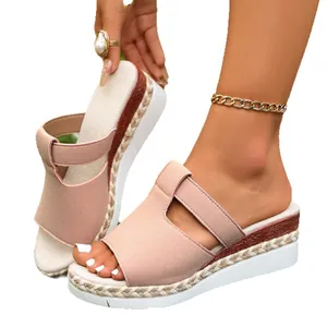 Stylish pink platform wedge sandals with a woven espadrille sole for fashionable women.