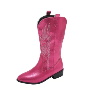 Metallic pink cowboy boots with white embroidery, pointed toe and low block heel detail.