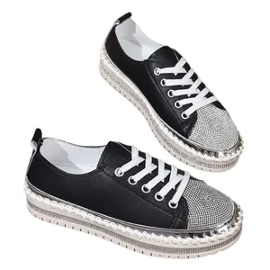 Stylish fashionable black leather platform sneakers for women with rhinestone toe detail