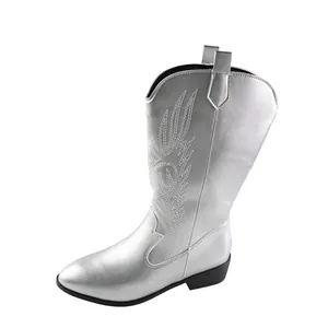 Detail view of silver embroidered cowboy boots with pointed toe and square heel