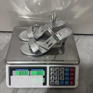 Detailed shot of silver metallic square toe high heel sandals weighing exactly 0.33kg