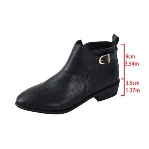 Close-up of the 3.5cm heel height and embossed crocodile texture on these black ankle boots