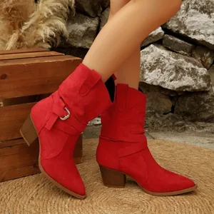 Detailed side view of stylish red suede western boots with belt buckle and chunky heel