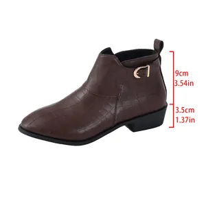 Detail view of brown crocodile-patterned ankle boots with 3.5cm block heel height.