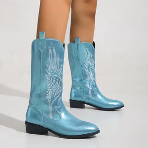 Light blue metallic cowboy boots with white embroidery, featuring pointed toe and block heel.
