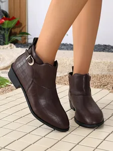 Brown crocodile-patterned ankle boots with a stylish side buckle and low block heel.