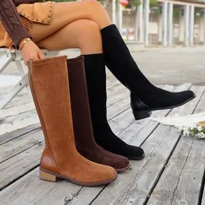 Close-up of women's winter knee-high boots in three colors with suede finish and square toe