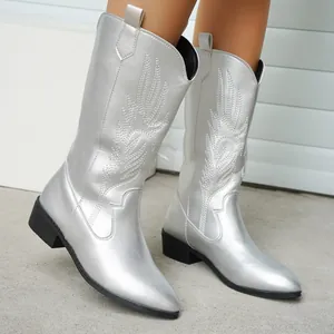 Detailed view of silver embroidered western knight boots with pointed toe and square heel