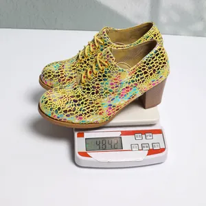 Weight measurement of stylish yellow pebble pattern block heel lace-up pumps for women