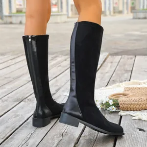 Black knee-high faux suede boots featuring a side zipper and stylish square toe design.
