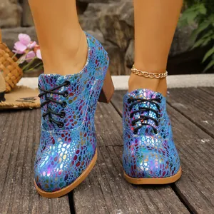 Vibrant blue metallic polka dot chunky heel lace-up shoes featuring a round toe design