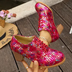 Detail view of these vibrant iridescent lace-up pumps with chunky heels and round toe design