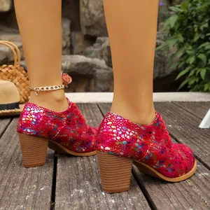 Detailed view of vibrant pink high heel shoes with colorful dot patterns