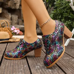 Detailed close-up of vibrant colorful patterned chunky heel lace-up women's Oxford shoes