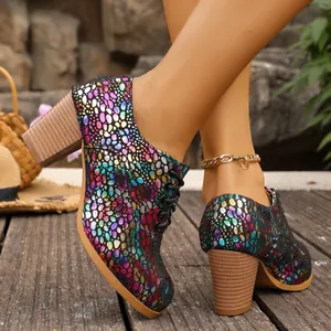 Detail of colorful iridescent pebble pattern and wood-textured chunky heel on women's shoe