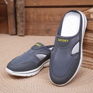 Detailed view of breathable grey mesh clogs with thick soles and sporty accents