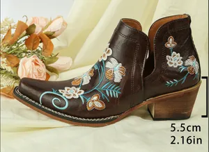 Detailed side view of vintage embroidered western ankle boots with 5.5cm block heel