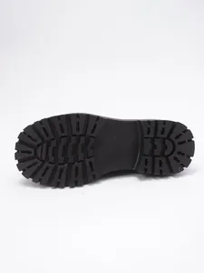 Macro view of the black non-slip rubber lug sole with embossed size 37 number marking