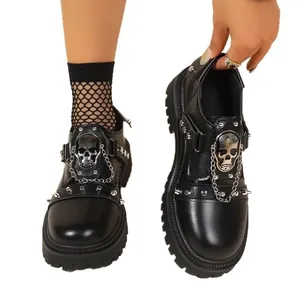 Punk style skull platform loafers with rivets and chains for dark fashion.