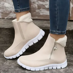 Side view of beige women's snow boots featuring star zipper and warm fleece lining