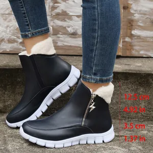 Side detail of black women's winter boots with fleece lining and size marks