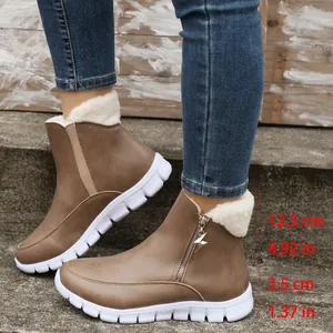 Close-up detail of women's winter snow boots with height and sole thickness measurements