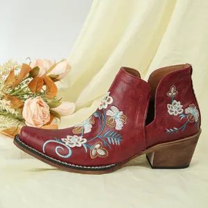 Vintage red women's western ankle boots with elegant floral embroidery and chunky wood heels