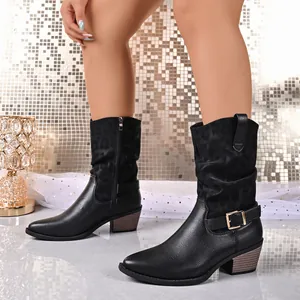 Detailed view of black mid-calf cowboy boots with subtle leopard print and buckle accent