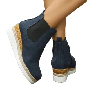 Navy blue suede wedge ankle boots with espadrille platform and side zipper.