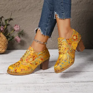 Vintage yellow satin embroidered ankle boots with lace-up front and chunky block heel