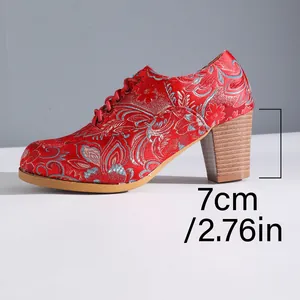 Side view of vintage red satin embroidered lace-up bootie with a 7cm chunky heel