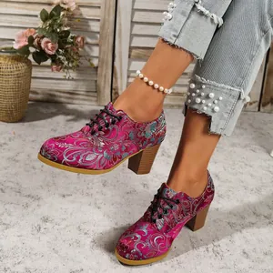Vintage fuchsia satin heels with intricate floral embroidery and lace-up chunky heel detail