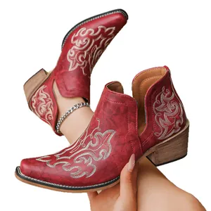 Vintage red ankle boots for women featuring intricate floral embroidery and a chunky heel.