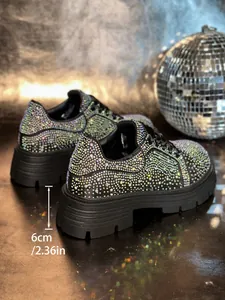 Close-up of 6cm platform sole on rhinestone sneakers with iridescent sparkle