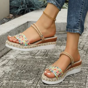 Detailed macro view showing stylish colorful woven hemp rope wedge sandals for summer