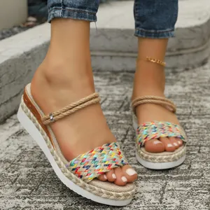 Close-up of vibrant rainbow braided strap and rope detail on platform wedge sandals