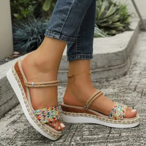 Detail view of colorful braided rope sandals featuring a stylish wedge platform sole.