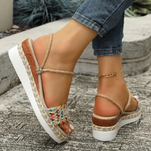 Detailed side view of women's colorful woven platform sandals with jute rope straps