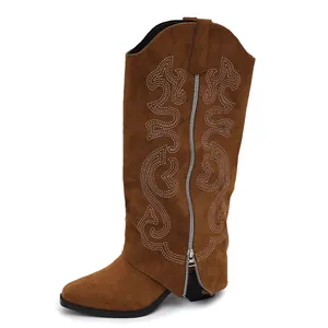 Side profile of brown suede embroidered western knee-high boots with side zipper and block heel