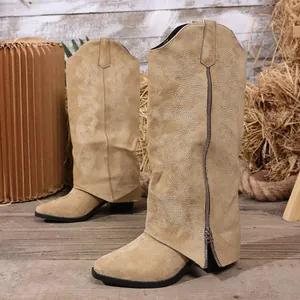 Detailed view of camel western knee-high boots with embroidery and side zipper.