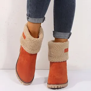 Warm women's orange suede winter snow boots with cream sherpa lining and thick sole