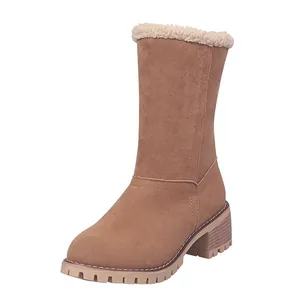 Warm tan mid-calf snow boots featuring a chunky heel and cozy faux shearling lining
