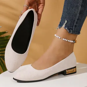 Elegant cream suede pointed toe flat shoes featuring decorative gold block heel details